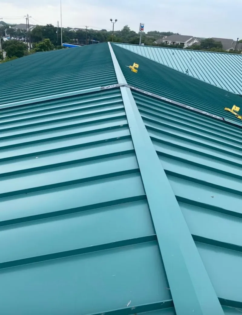 Green commercial metal roof ridge and valley for Metal Roof Repair in Walworth